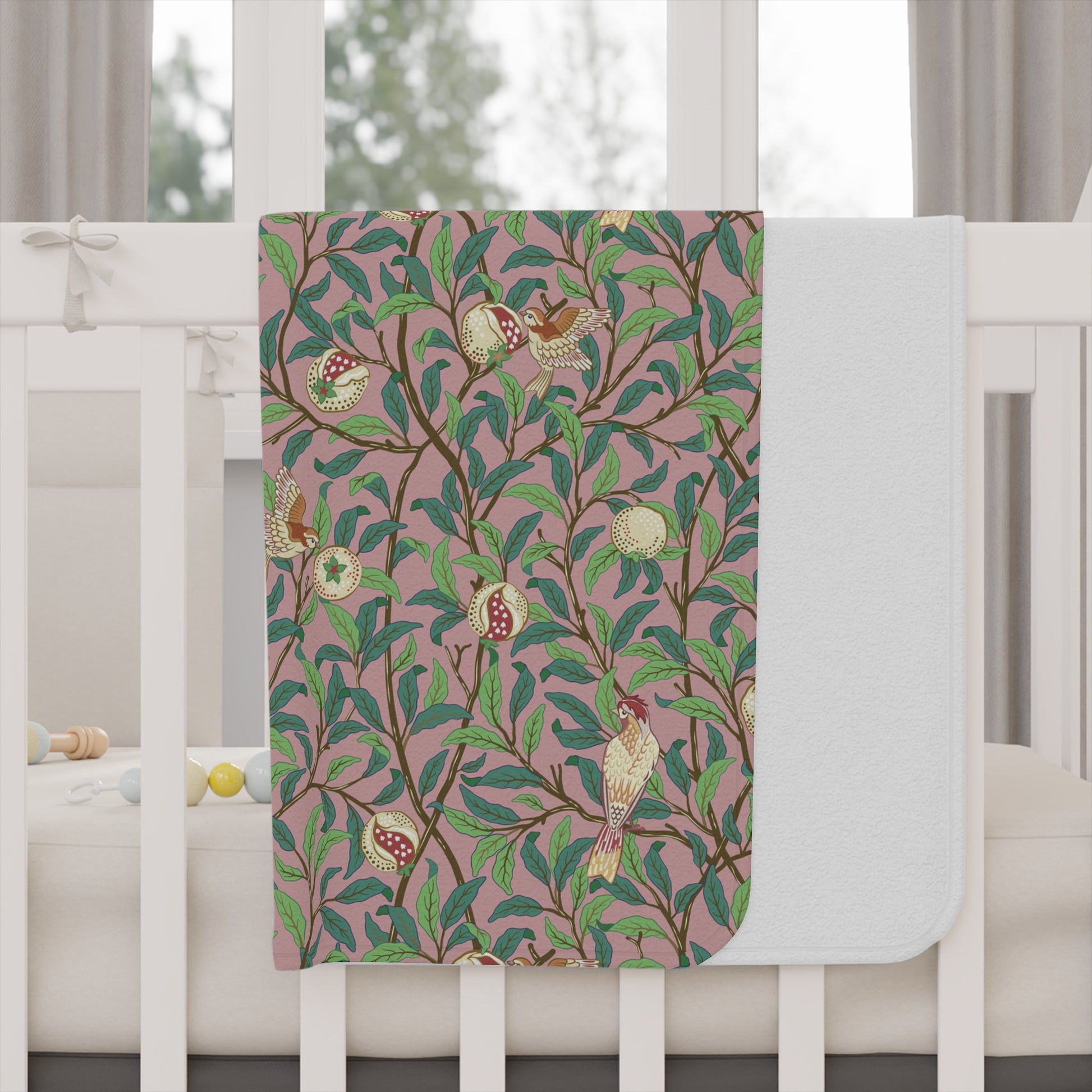 Toddler Blanket with nature-themed design on a white table