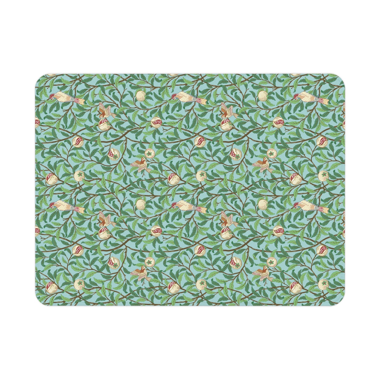 Patterned mat with birds and leaves on a blue background