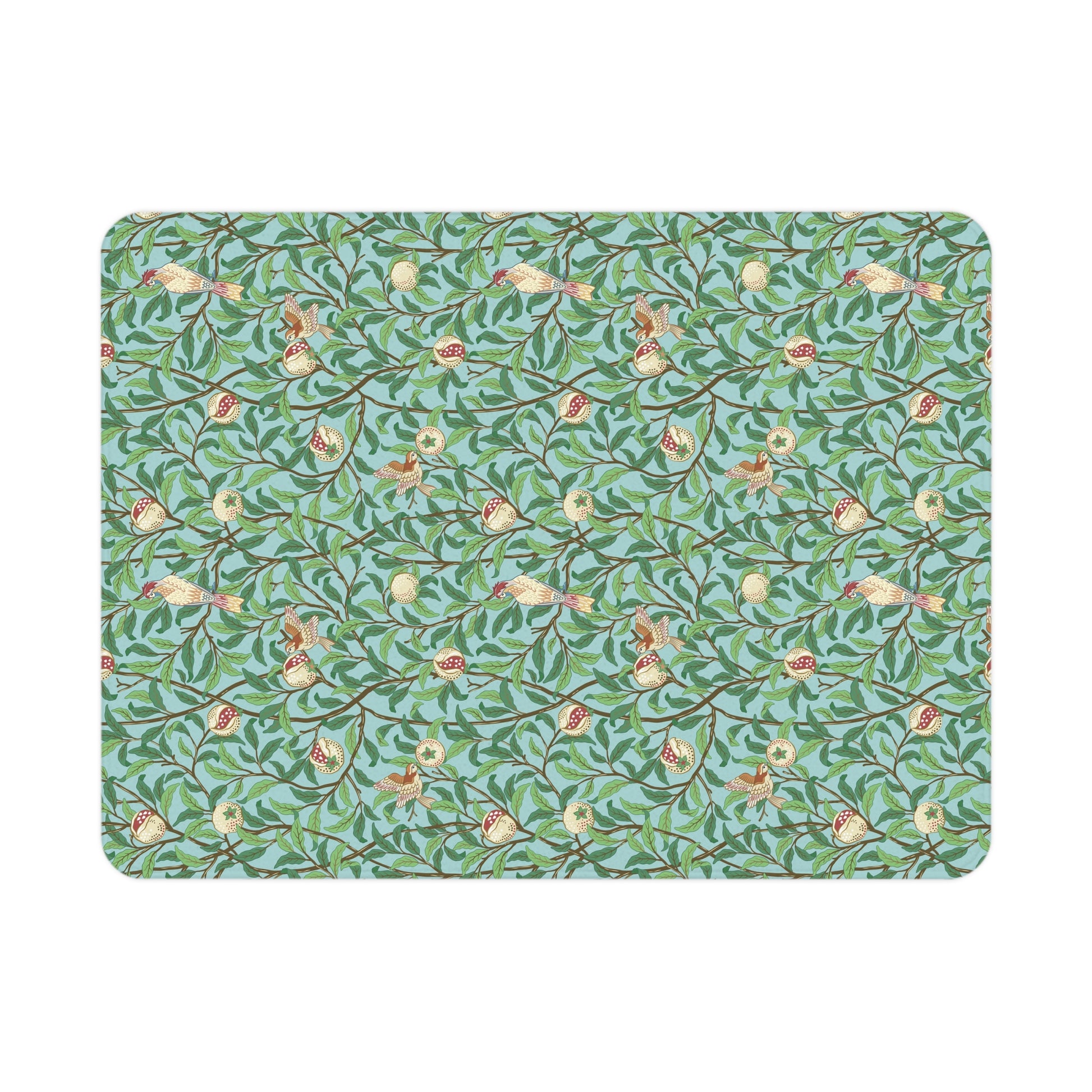 Patterned mat with birds and leaves on a blue background