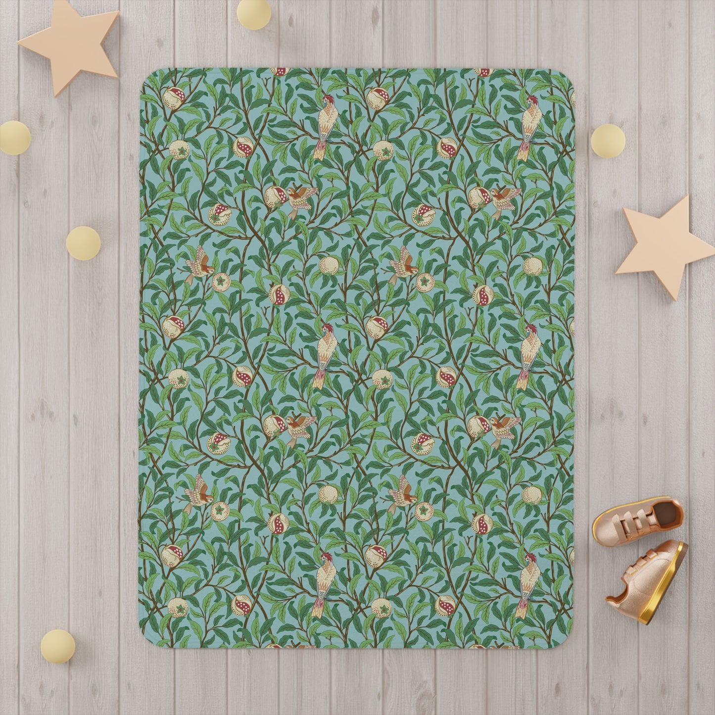 Floral patterned rug on a wooden floor with decorative stars and shoes.