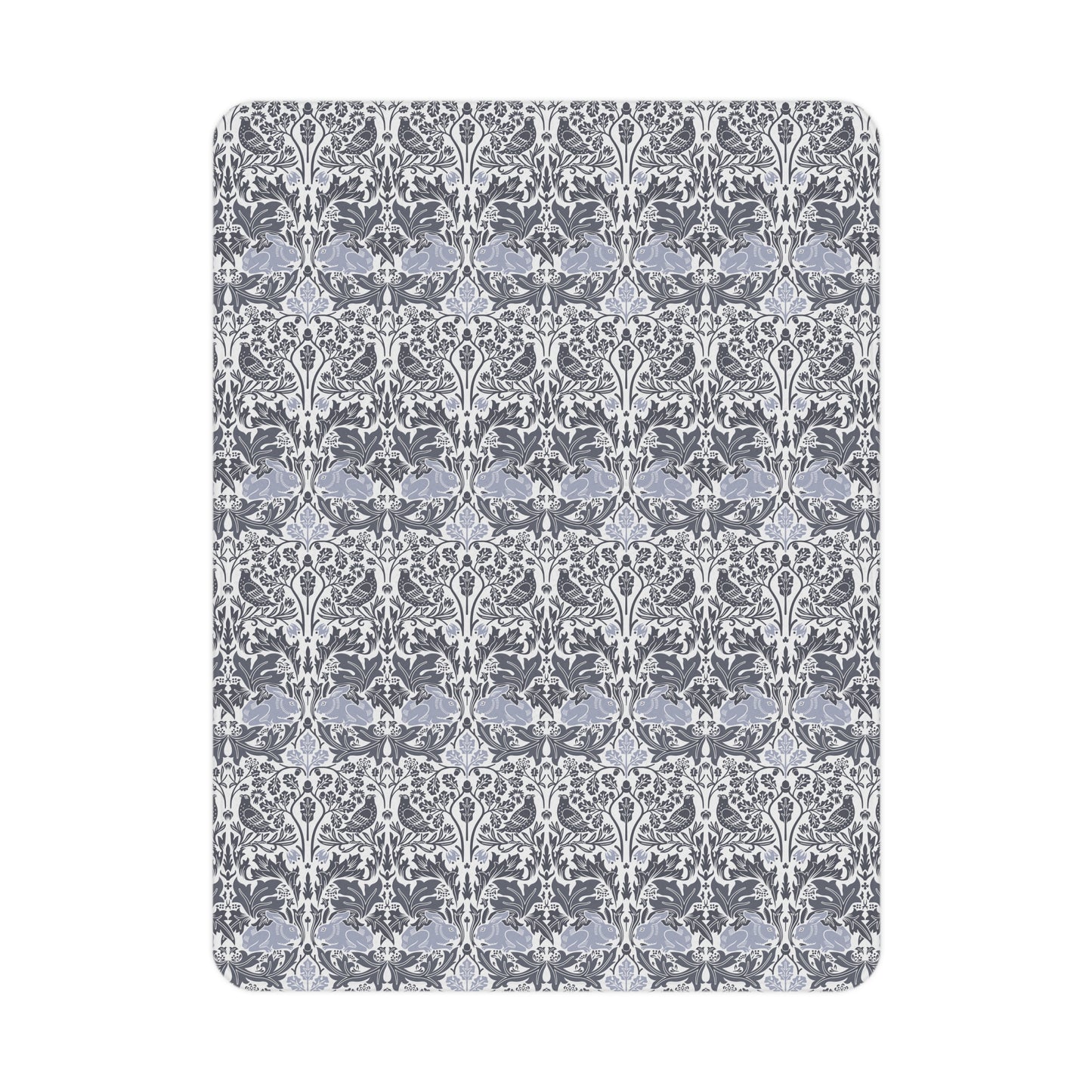 Patterned rug with white floral design on a gray background
