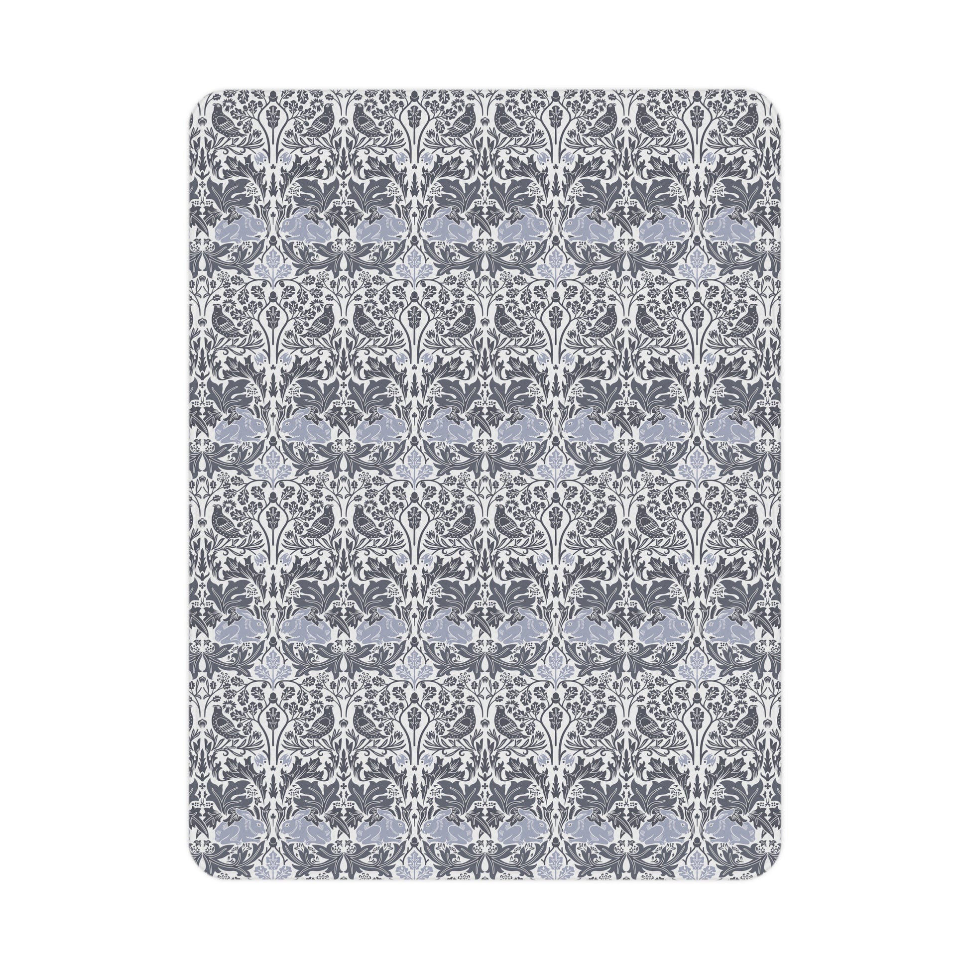Patterned rug with white floral design on a gray background