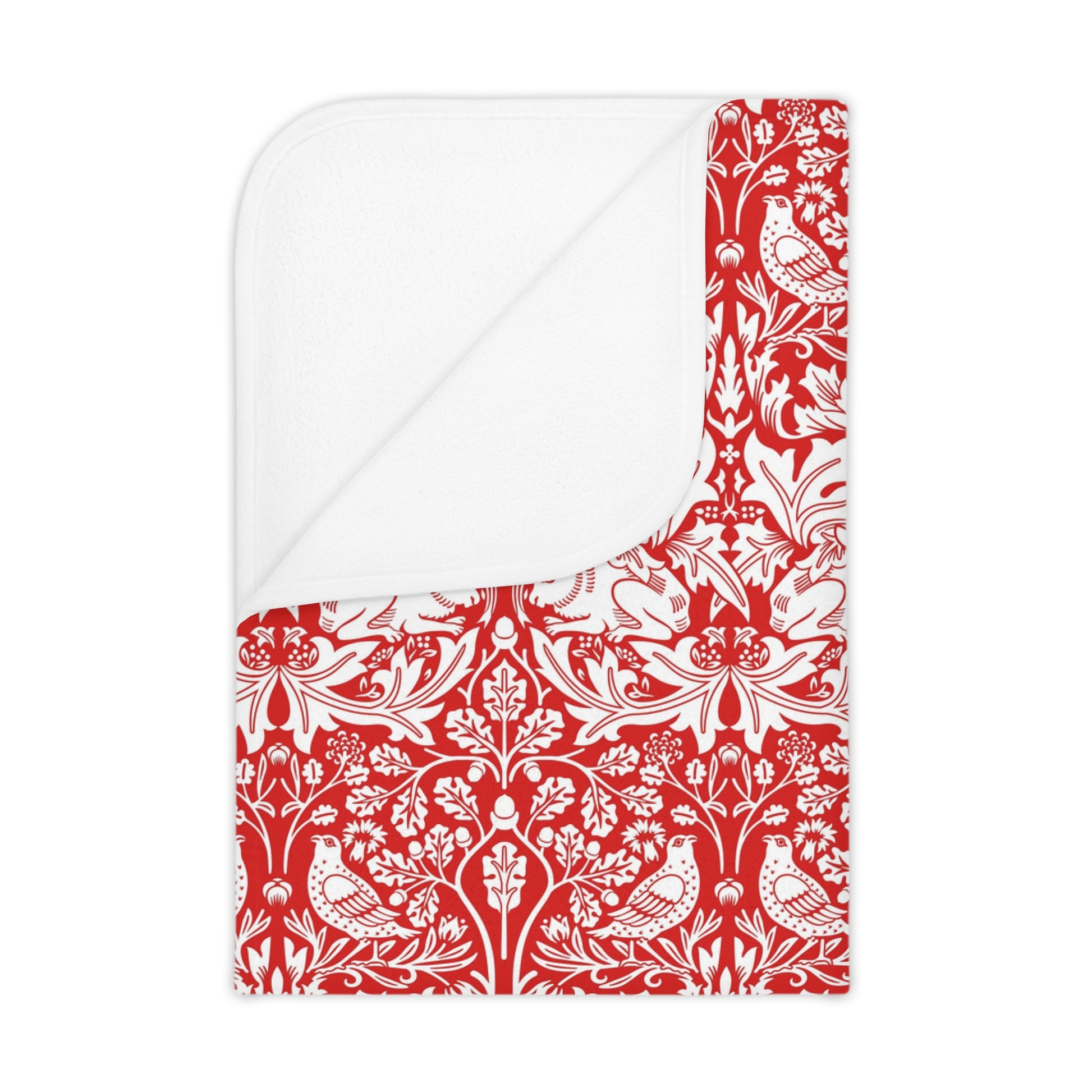 Red and white floral and bird patterned fabric with a white border
