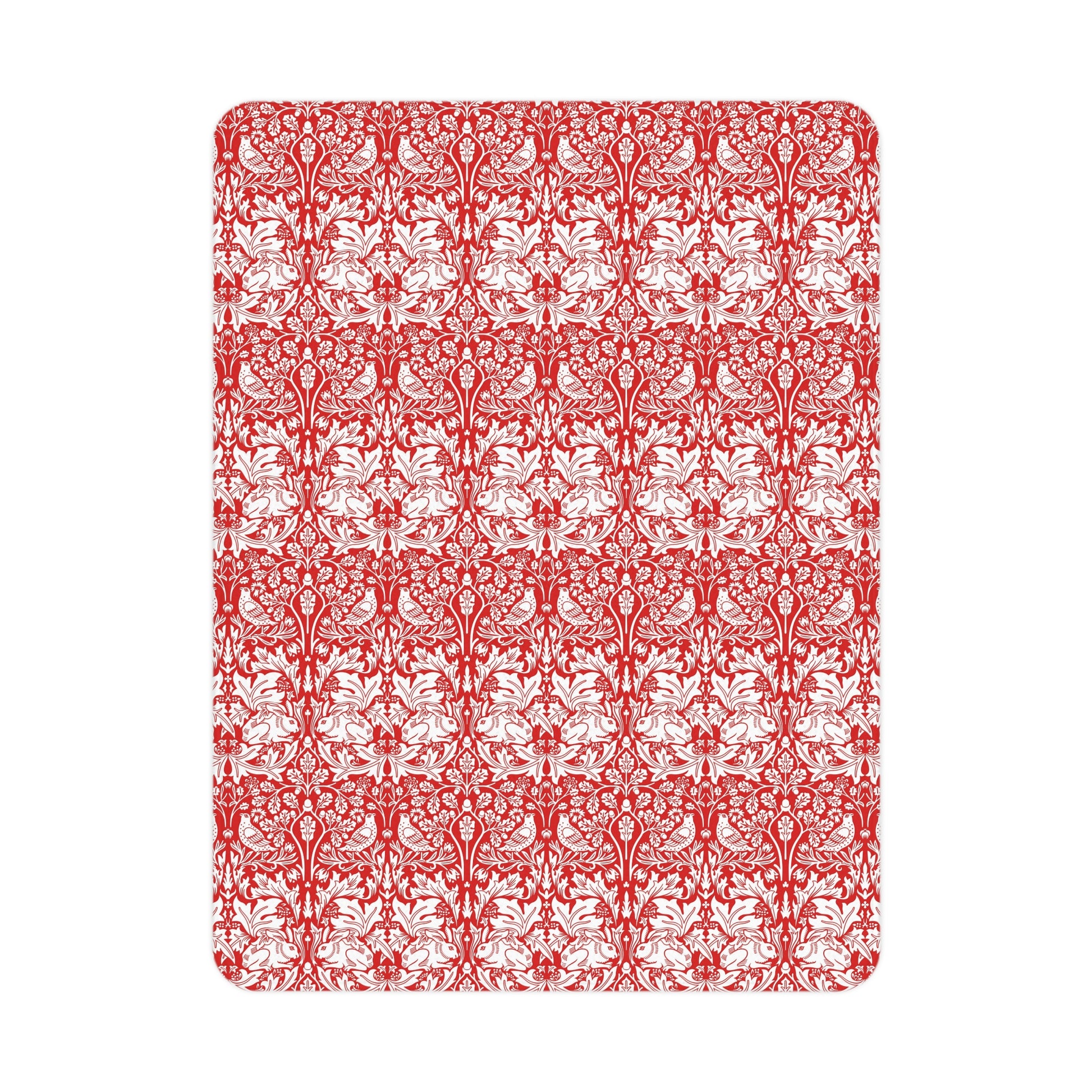 Red and white floral patterned rug on a white background
