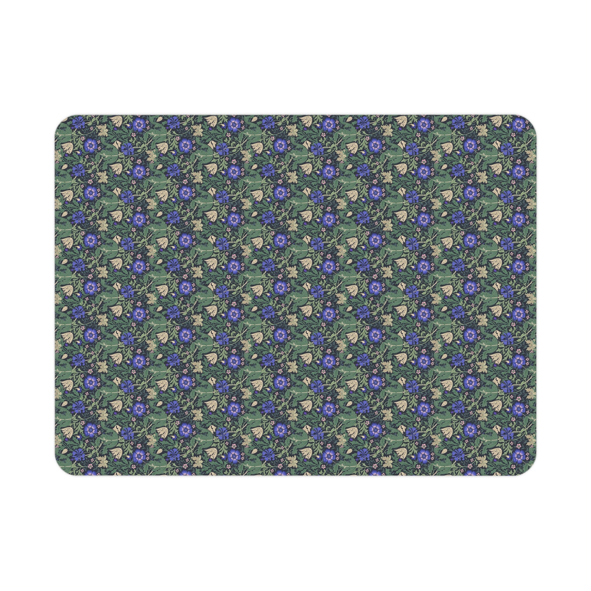 Floral patterned mat with blue flowers on a green background
