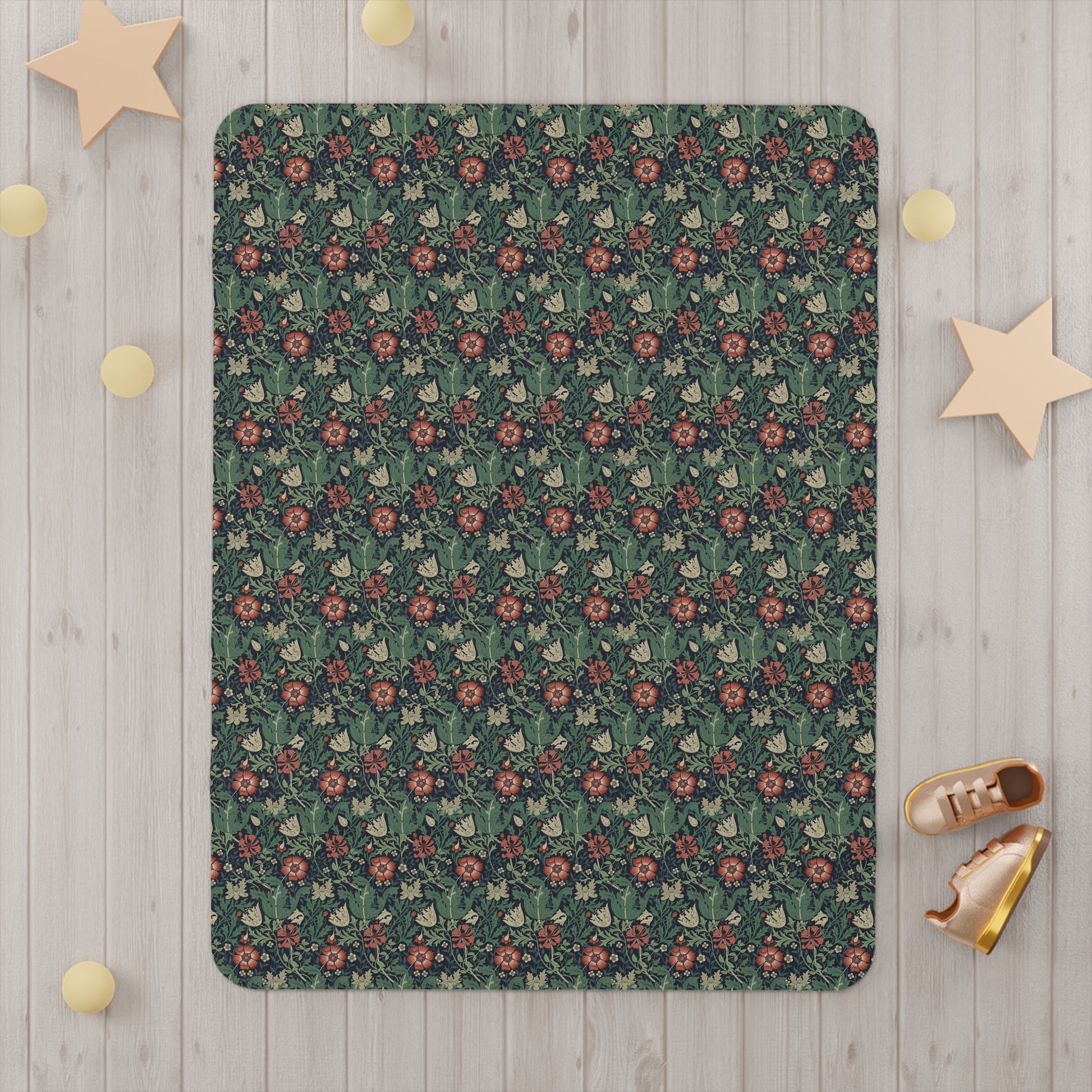 Floral patterned rug on a wooden floor with decorative stars and shoes.