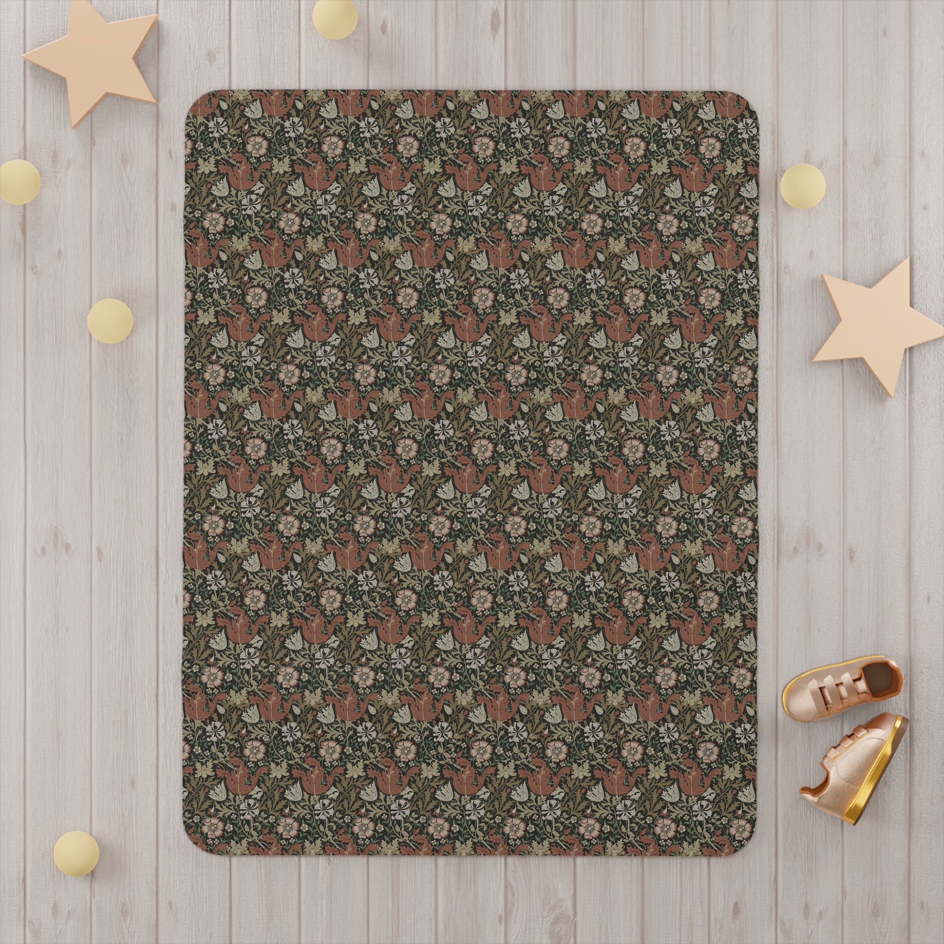 Floral patterned rug on a wooden floor with decorative stars and shoes around it.
