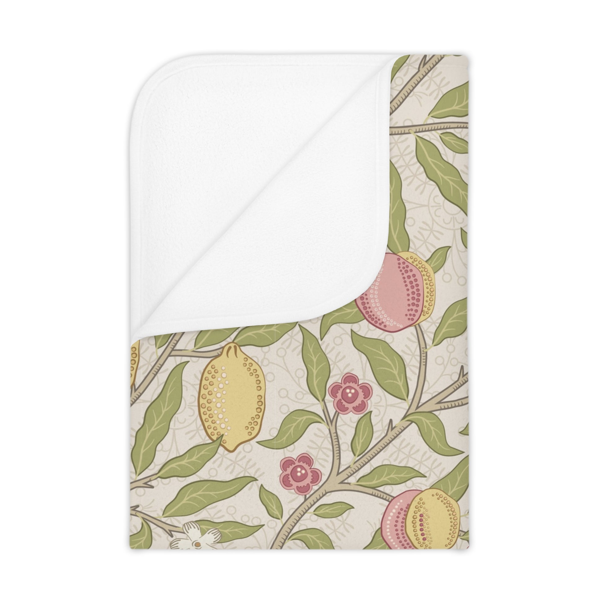 Floral and fruit patterned fabric with a white border on a beige background