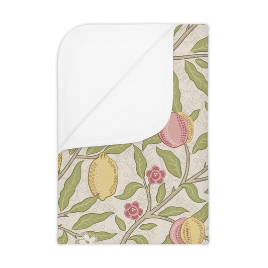 Floral and fruit patterned fabric with a white border on a beige background