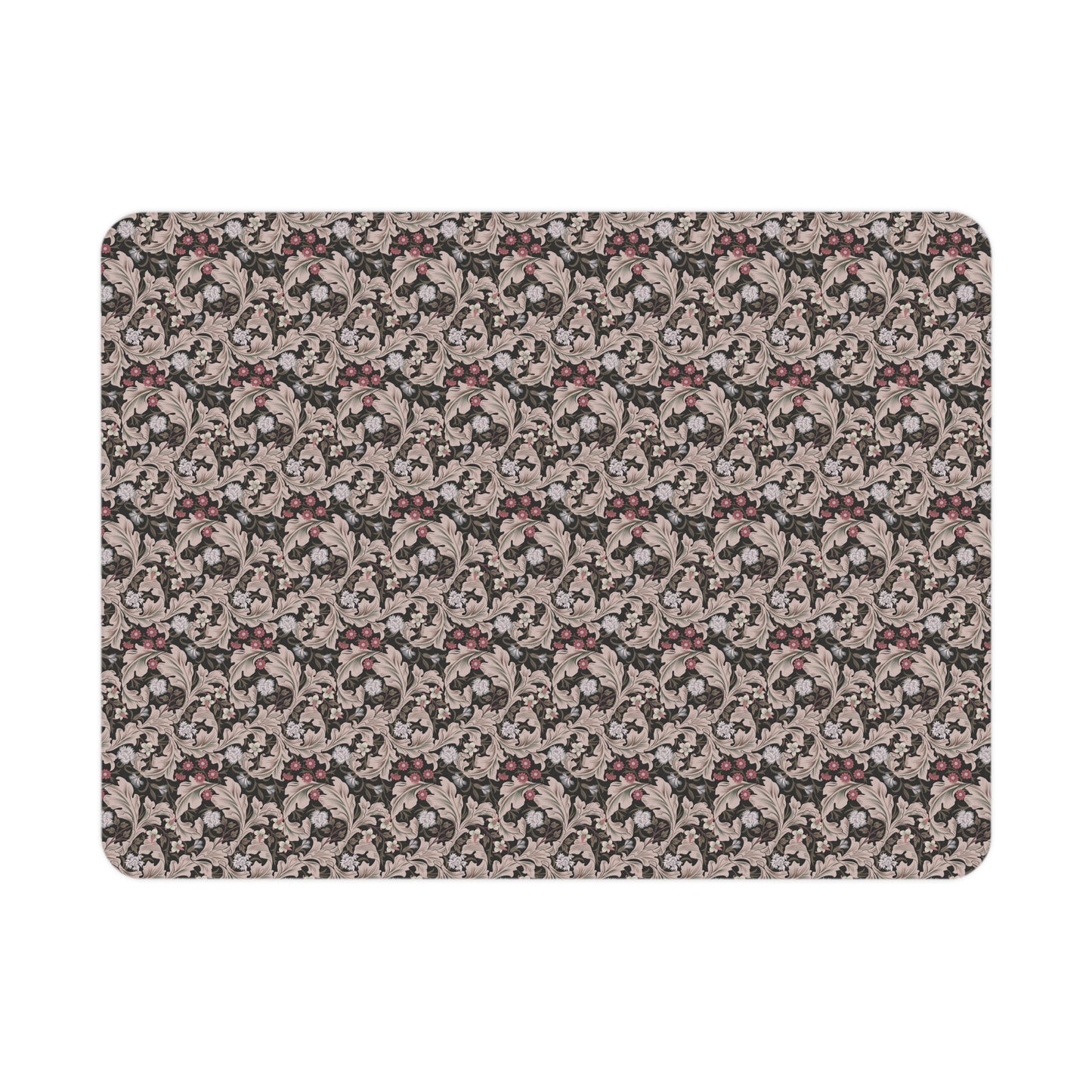 A toddler blanket with a floral pattern inspired by William Morris, in mocha and white colours, folded neatly.