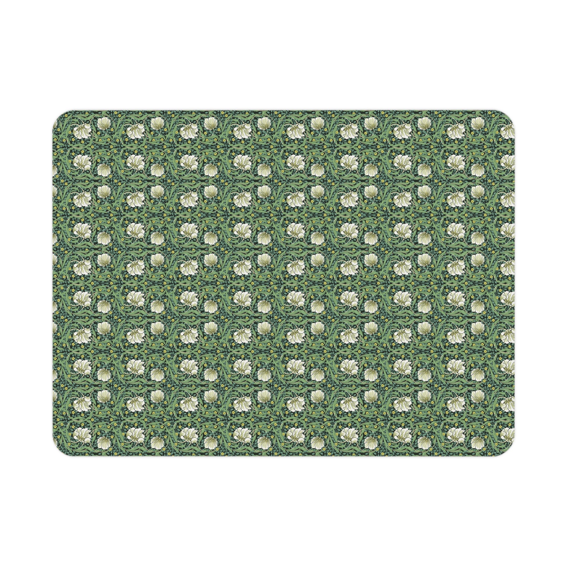 Green floral William Morris & Co Pimpernel patterned toddler blanket draped over a crib