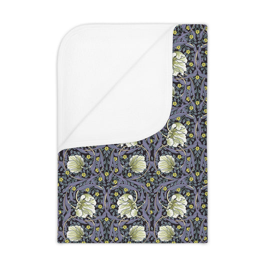 Floral William Morris & Co patterned toddler blanket on a purple and white pimpernel background