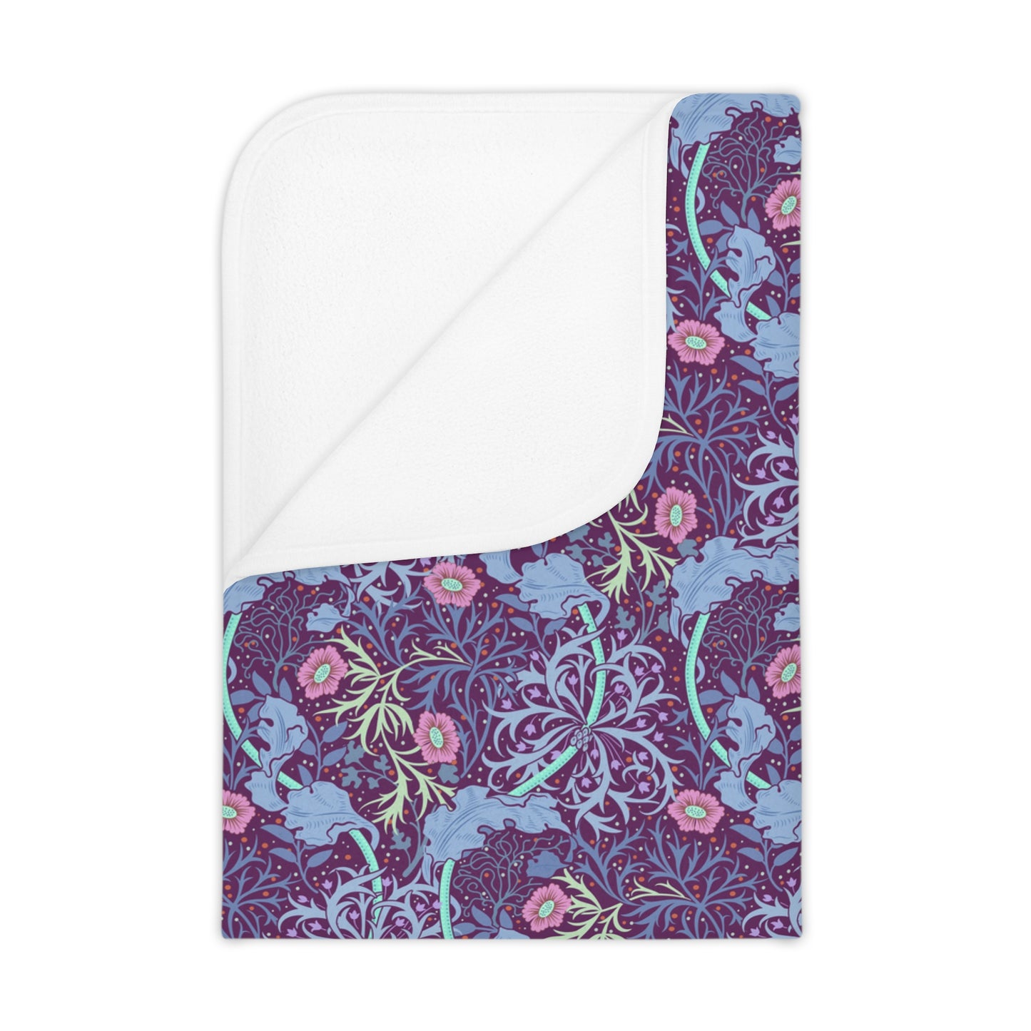 A toddler blanket with a floral pattern in shades of pink and purple, inspired by William Morris' Seaweed Collection.
