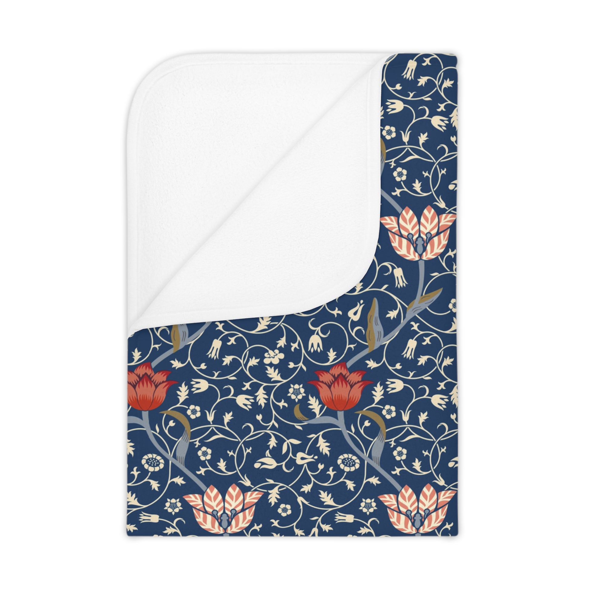 Floral William Morris & Co patterned toddler blanket with red flowers and white leaves on a blue background