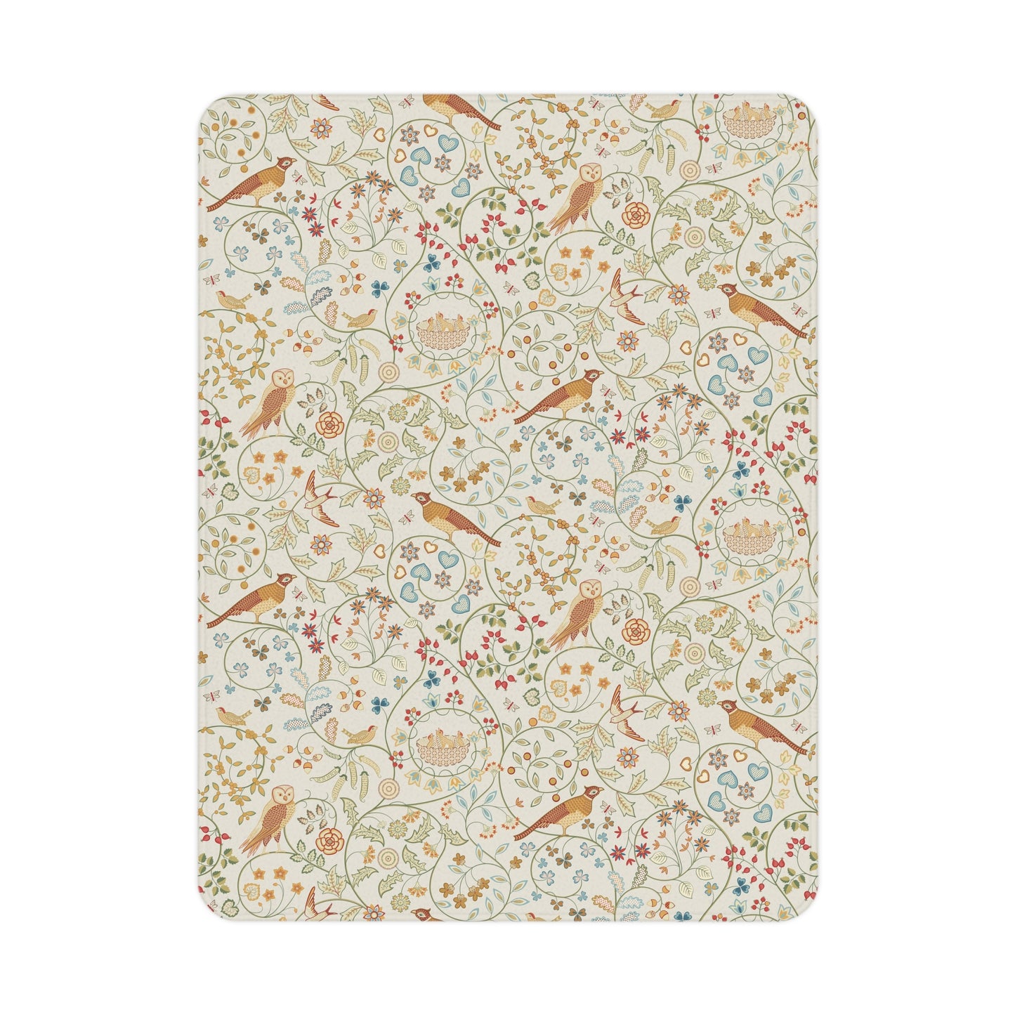 A toddler blanket with a floral and bird pattern inspired by William Morris, in vibrant colours on a light background, folded neatly.
