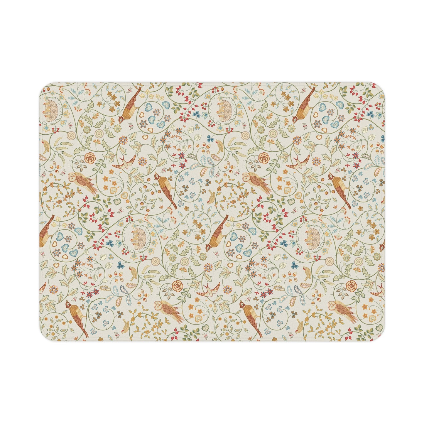 A toddler blanket with a floral and bird pattern inspired by William Morris, in vibrant colours on a light background, folded neatly.