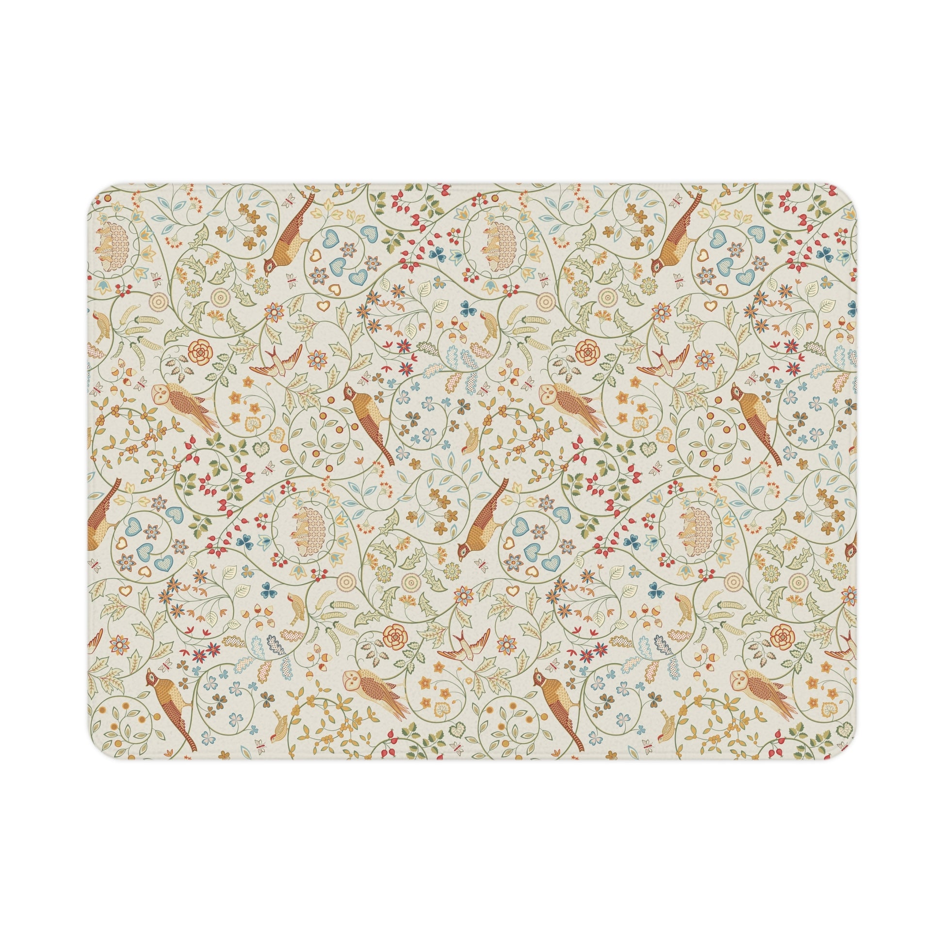 A toddler blanket with a floral and bird pattern inspired by William Morris, in vibrant colours on a light background, folded neatly.