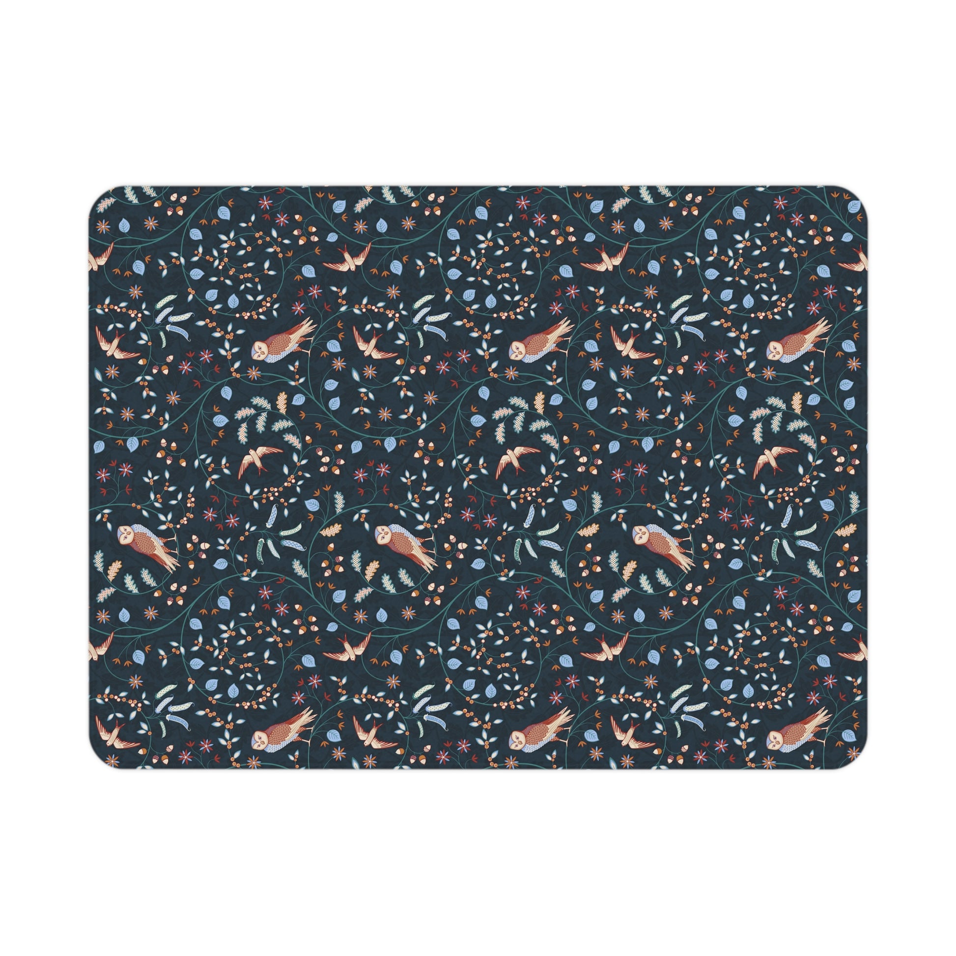 Floral and bird patterned Willy Morris & Co toddler blanket on a white background