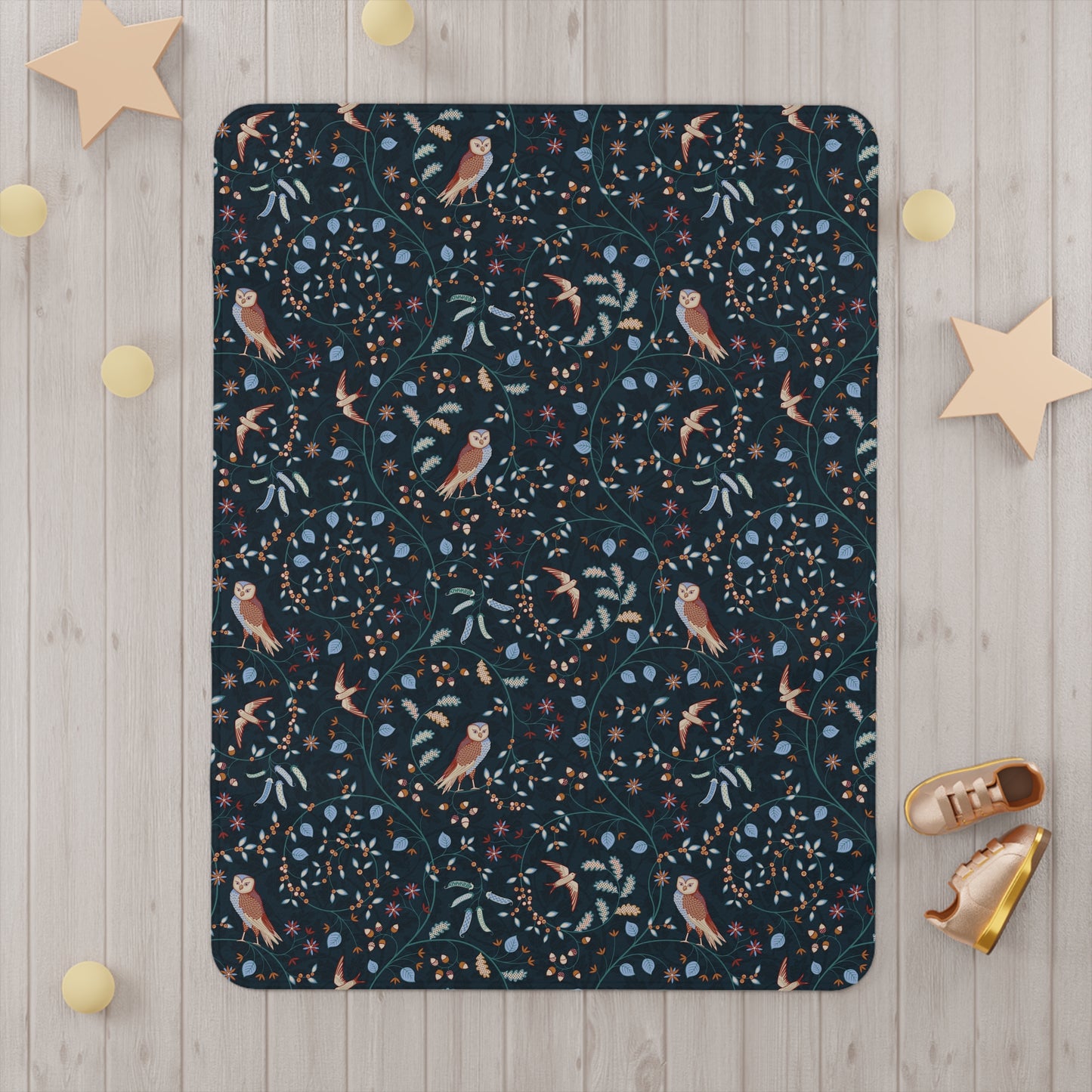 Floral and bird patterned Willy Morris & Co toddler blanket on a white background