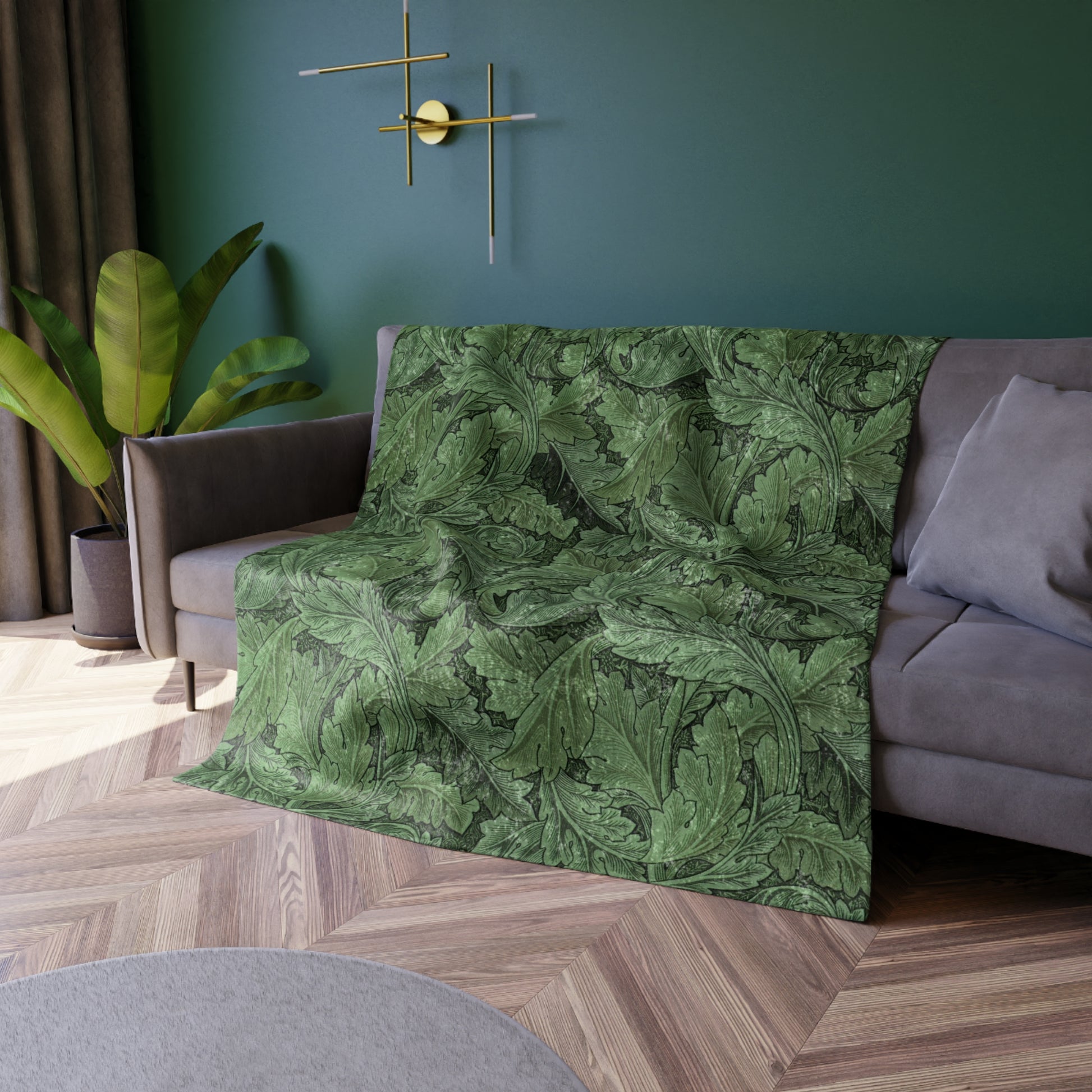 A lush crushed velvet blanket in green with a floral William Morris & Co pattern, featuring hemmed edges and a silky finish.