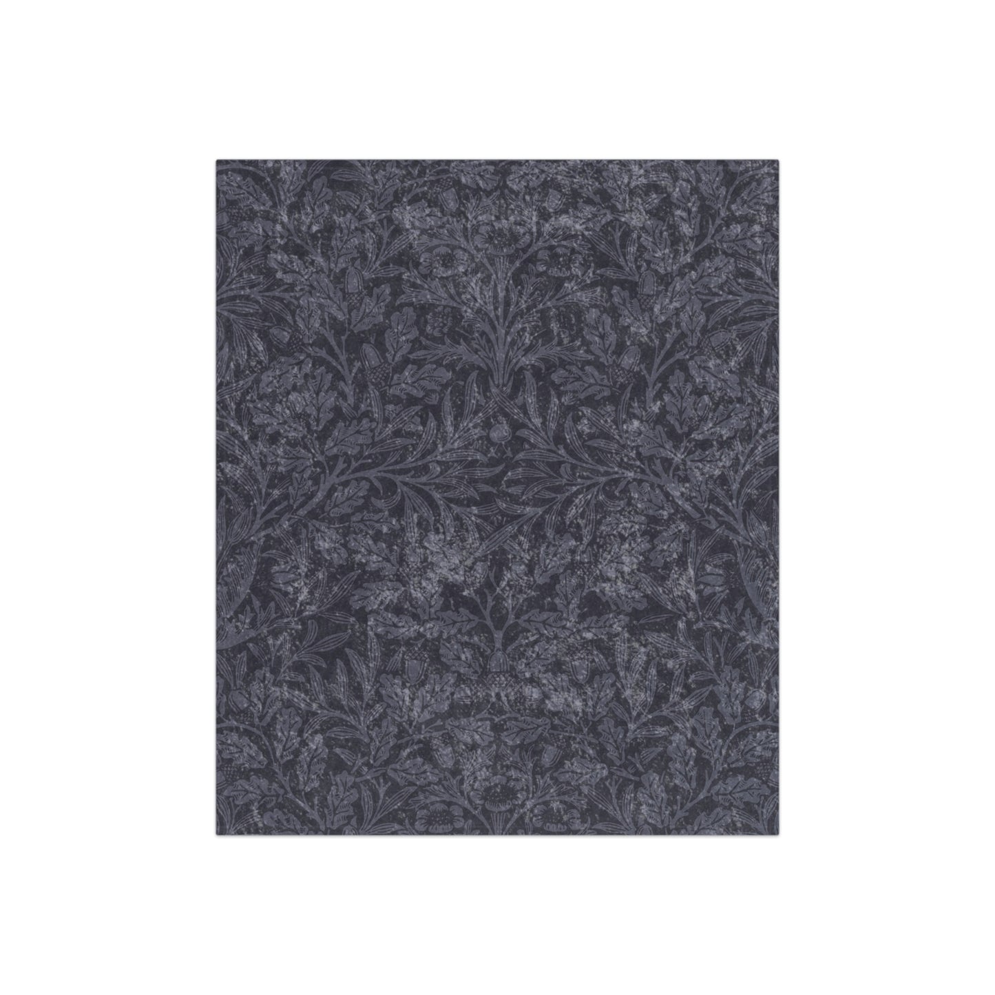 A smoky blue crushed velvet blanket with a floral pattern inspired by William Morris.