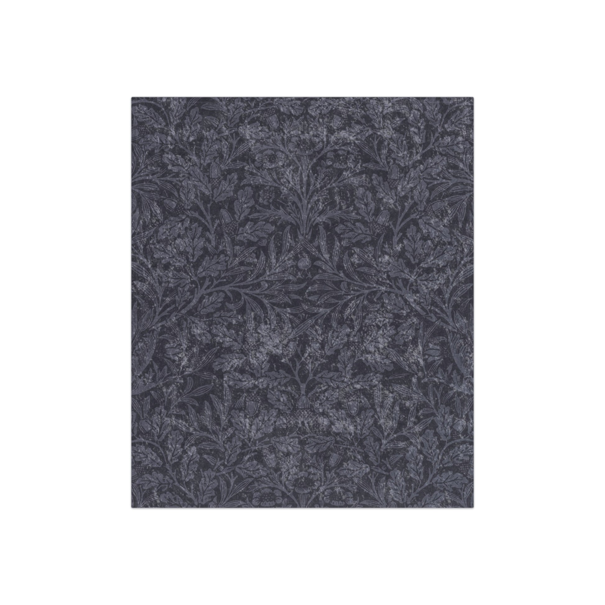 A smoky blue crushed velvet blanket with a floral pattern inspired by William Morris.