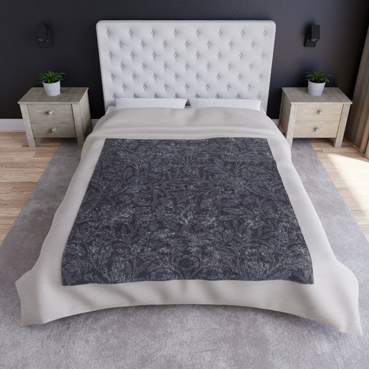 A smoky blue crushed William Morris & Co velvet blanket with a silky finish, laid flat showing both the front and hemmed edges.