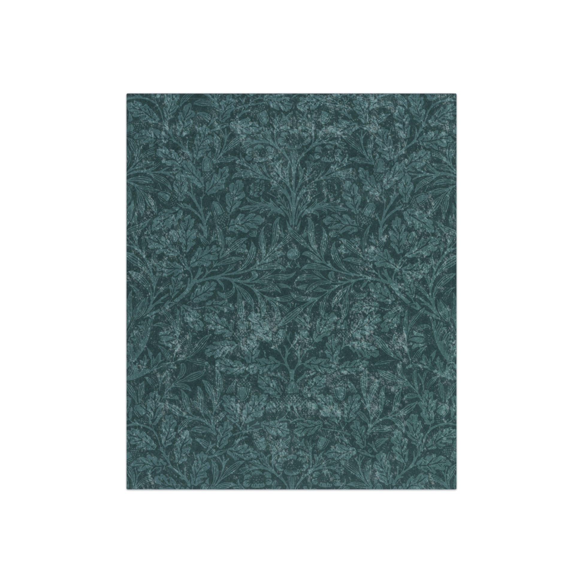 A plush, teal-colored crushed velvet blanket with a floral pattern, folded to show both the front and the silky, lustrous underside.