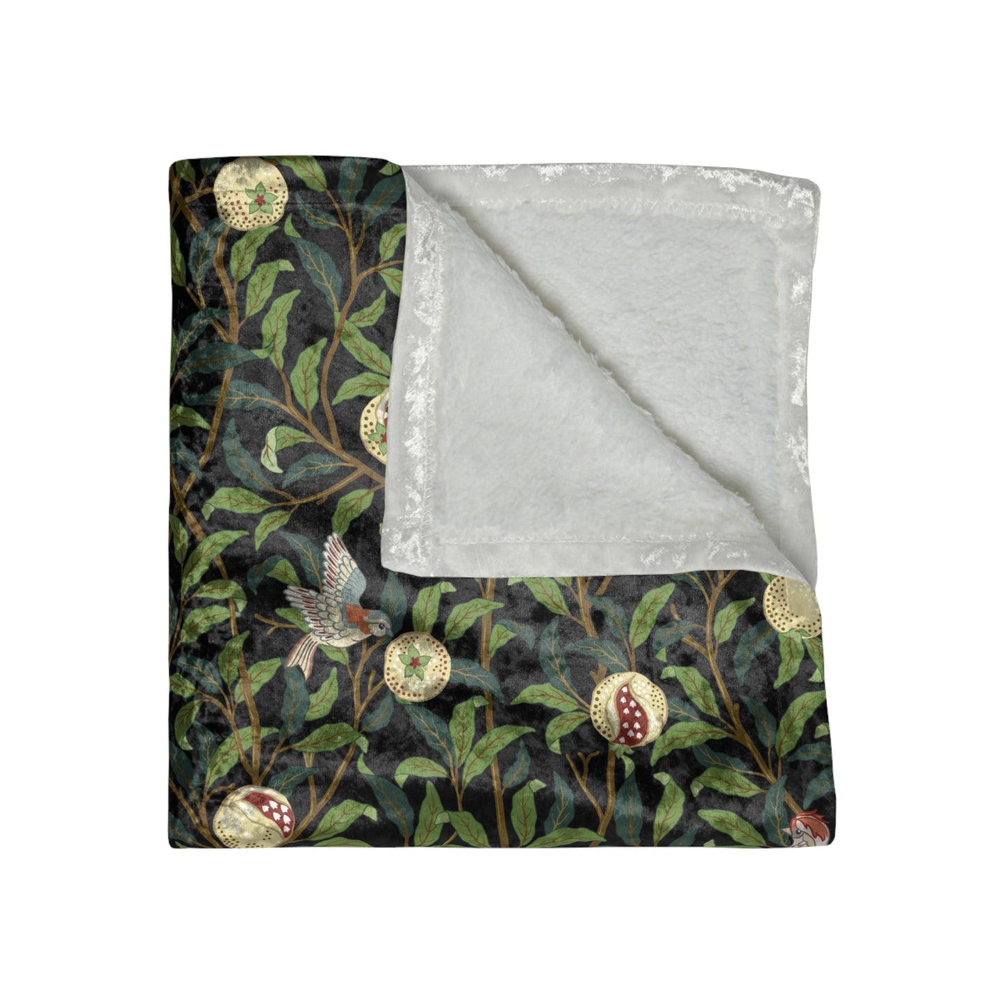 A plush velvet blanket with a one-sided print featuring a bird and pomegranate design on a dark background, with hemmed edges and a silky finish.