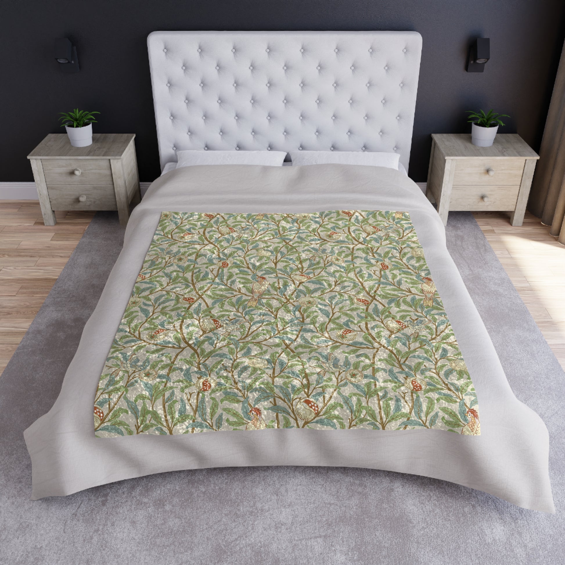A lush crushed velvet blanket with a floral pattern in green and beige shades, inspired by William Morris' Bird & Pomegranate Collection, displayed on a white background.