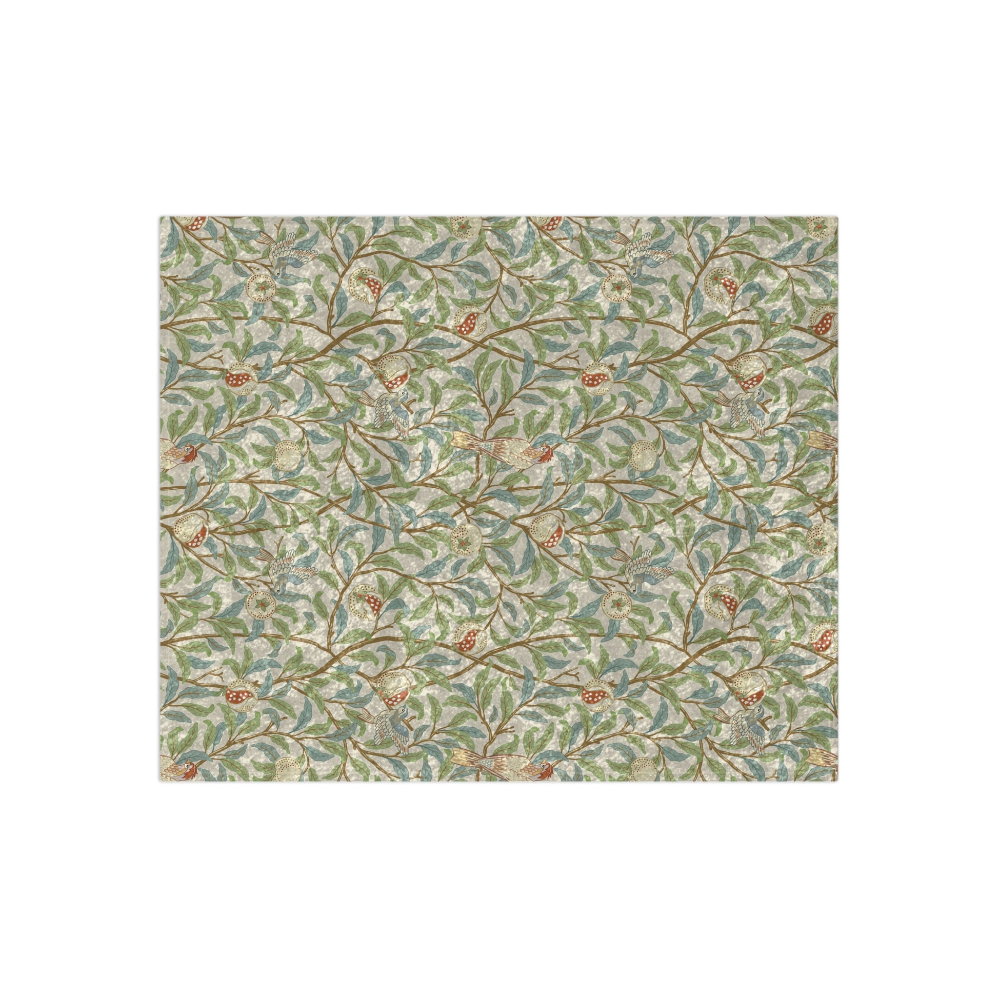 A lush crushed velvet blanket with a floral pattern in green and beige shades, inspired by William Morris' Bird & Pomegranate Collection, displayed on a white background.