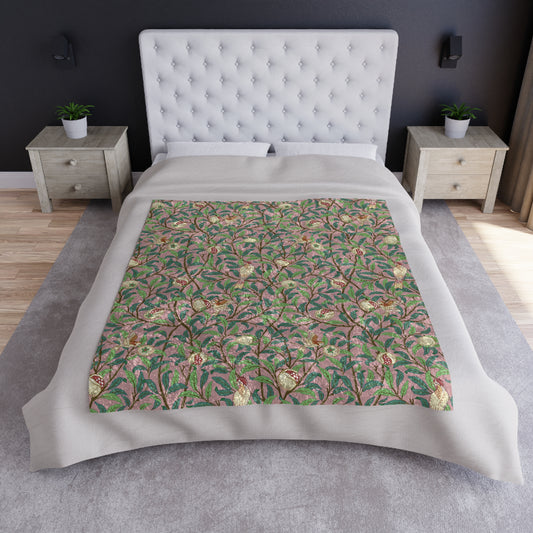 A plush, floral patterned velvet blanket with hemmed edges, inspired by William Morris' Bird & Pomegranate Collection.