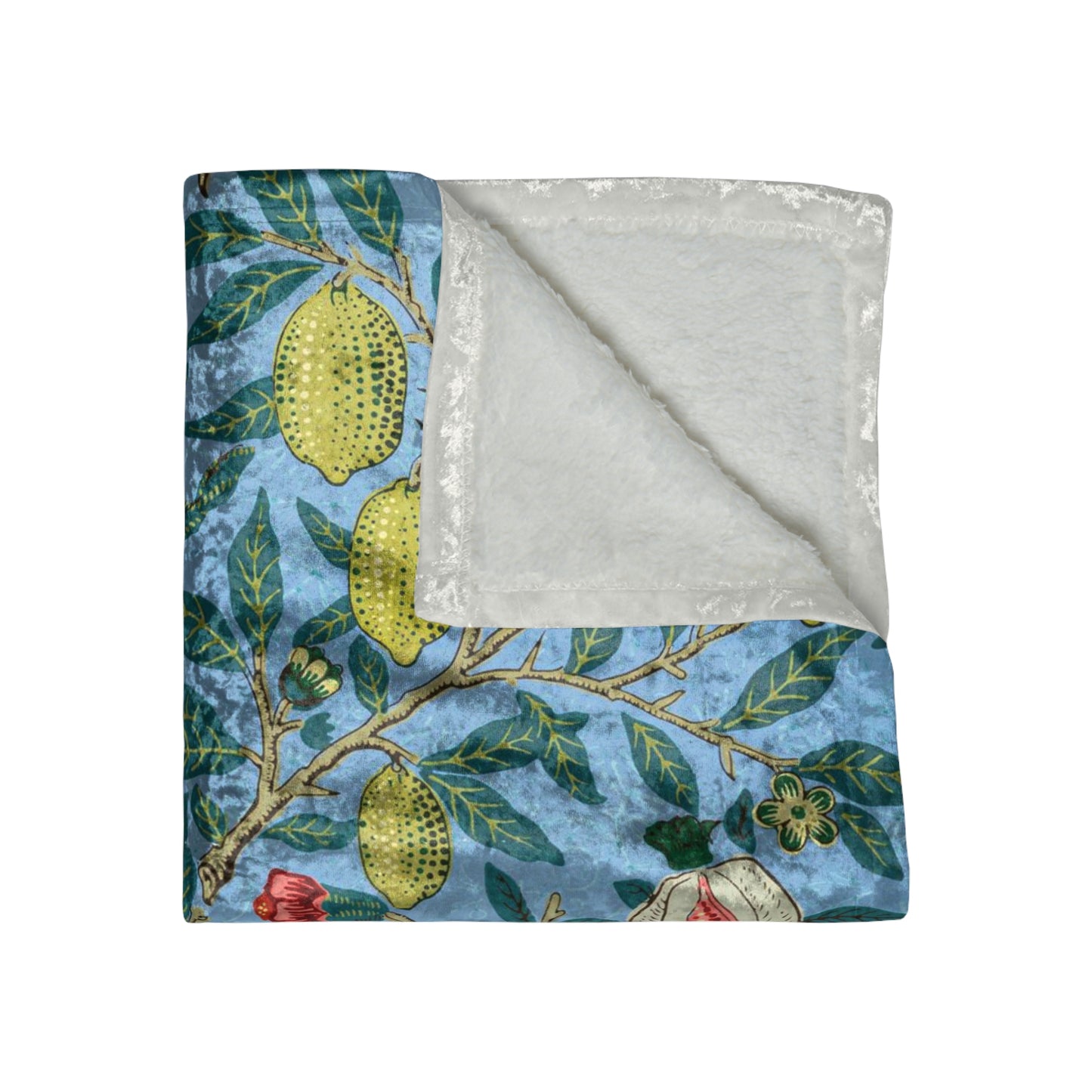 A lush crushed velvet blanket with a William Morris & Co floral pattern in blue and green shades, featuring a hemmed edge and a silky finish.