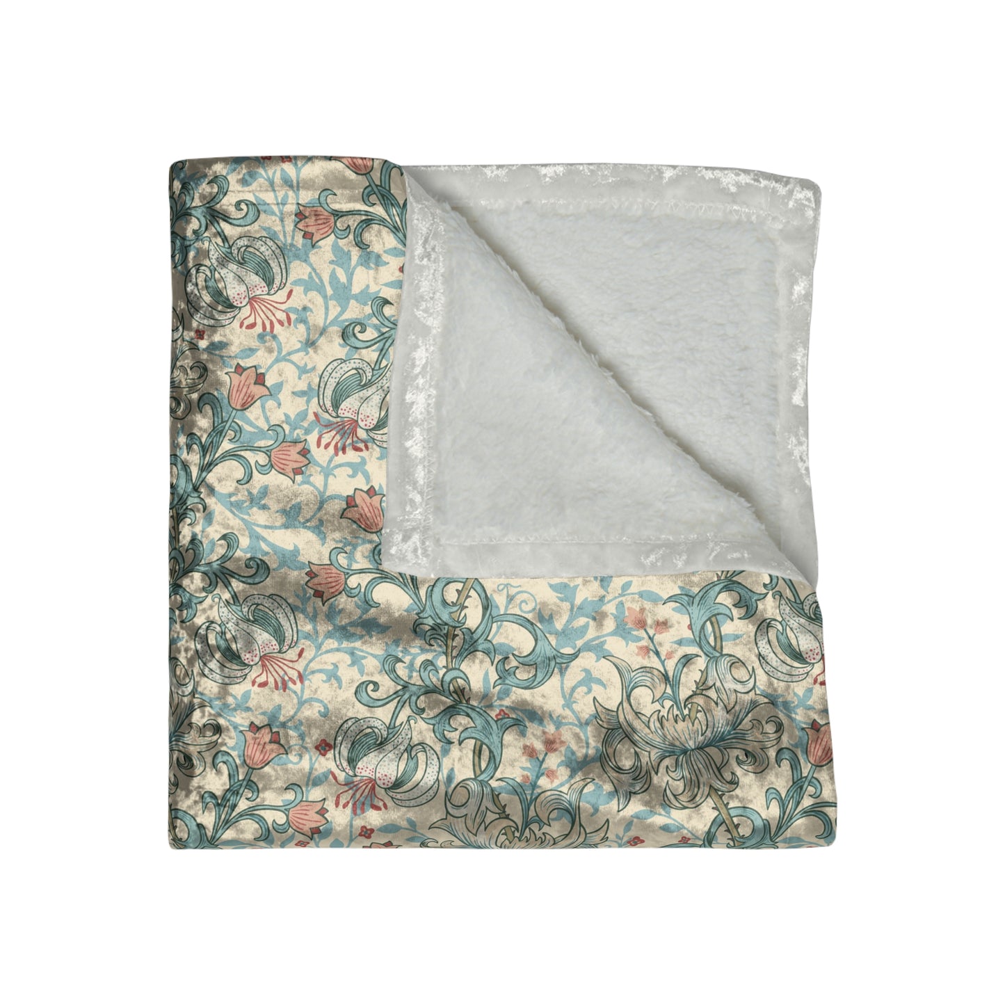 A plush velvet blanket with a floral pattern in a mineral colour palette, folded neatly to show both the patterned side and the silky reverse.