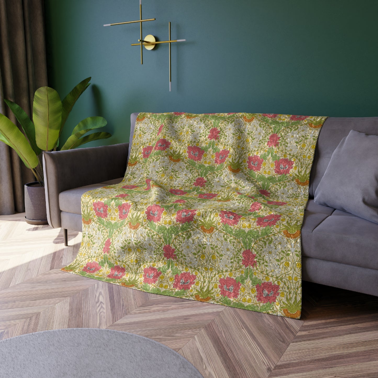 A lush crushed velvet blanket with a floral William Morris & Co pattern in shades of green, pink, and yellow, hemmed edges, and a silky finish.