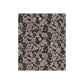 A crushed velvet blanket with a floral pattern in mocha color.