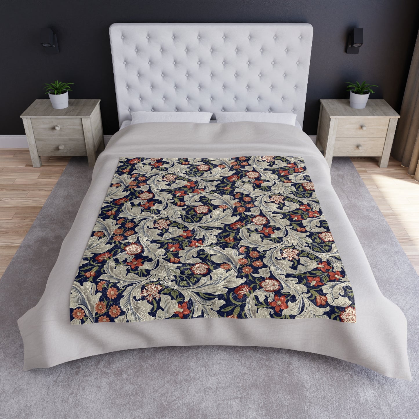 A lush crushed velvet blanket with a floral William Morris & Co pattern in shades of blue, red, and white, hemmed edges, and a silky finish.