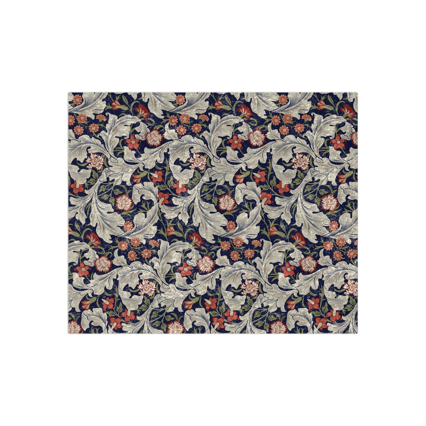 A lush crushed velvet blanket with a floral William Morris & Co pattern in shades of blue, red, and white, hemmed edges, and a silky finish.