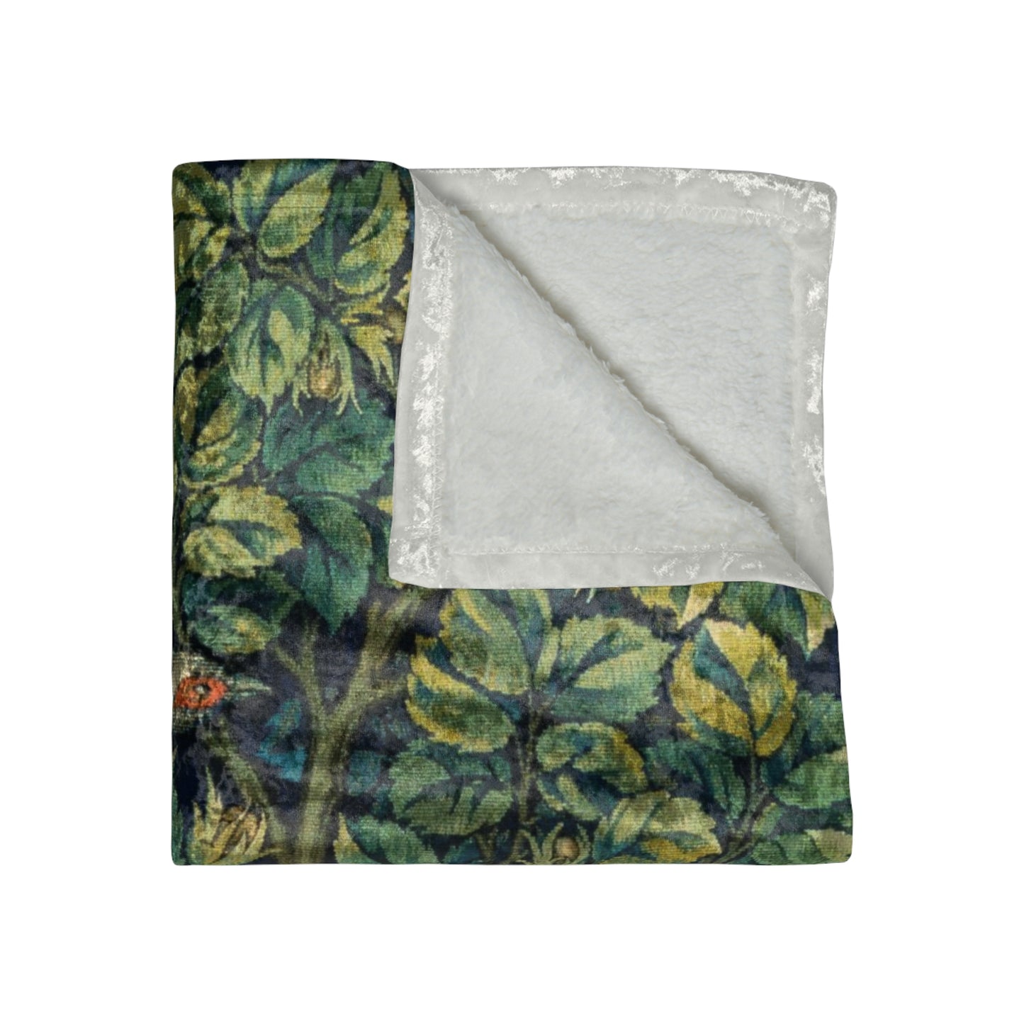 A lush crushed velvet blanket with a floral William Morris & Co pattern in shades of green and yellow, hemmed edges, and a silky finish.
