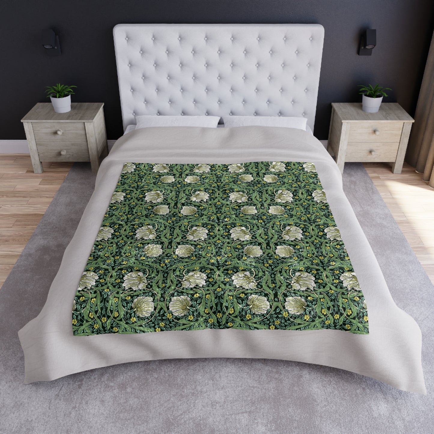 A lush crushed velvet blanket in green with a William Morris & Co floral pattern, hemmed edges, and a silky finish.