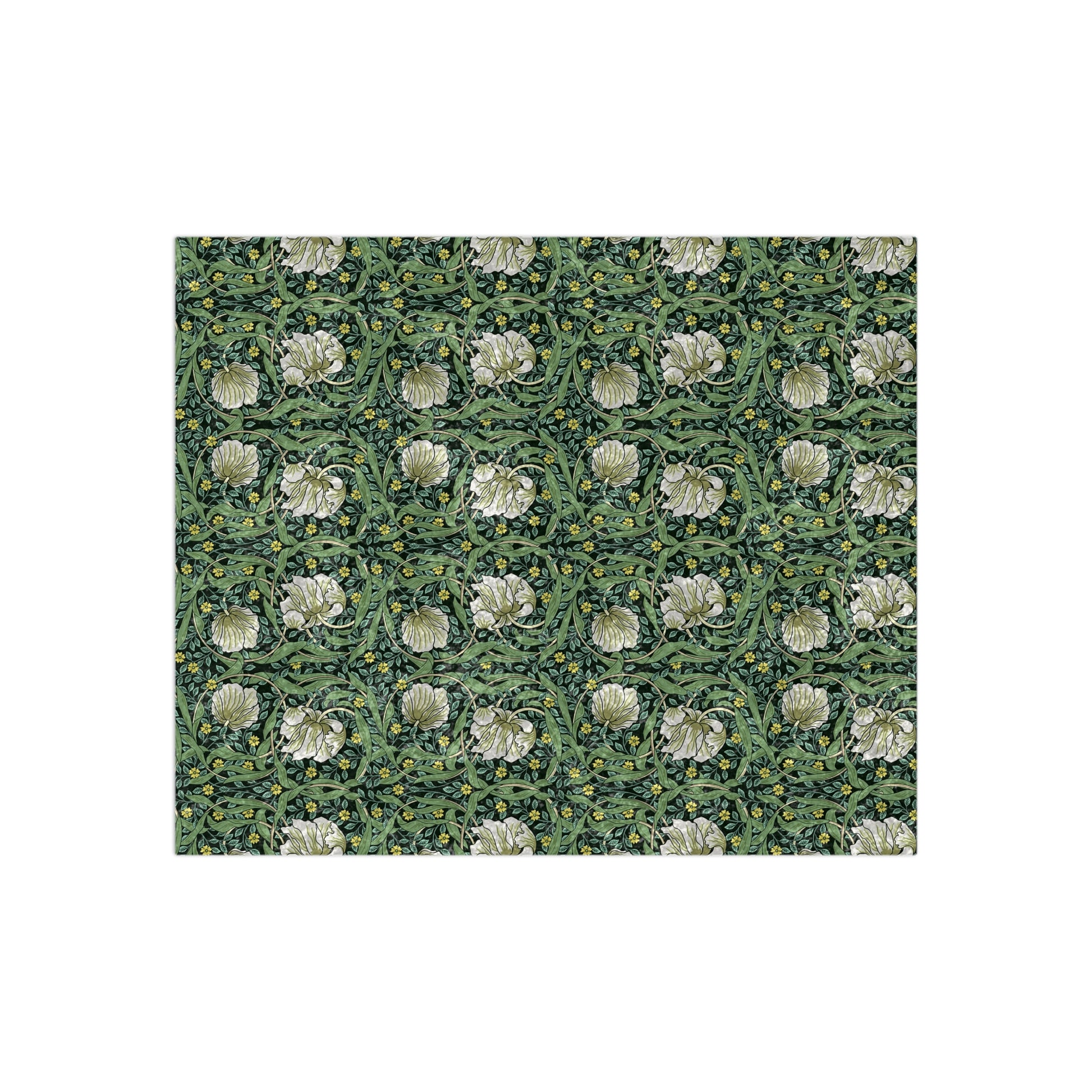 A lush crushed velvet blanket in green with a William Morris & Co floral pattern, hemmed edges, and a silky finish.