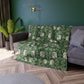 A lush crushed velvet blanket in green with a William Morris & Co floral pattern, hemmed edges, and a silky finish.