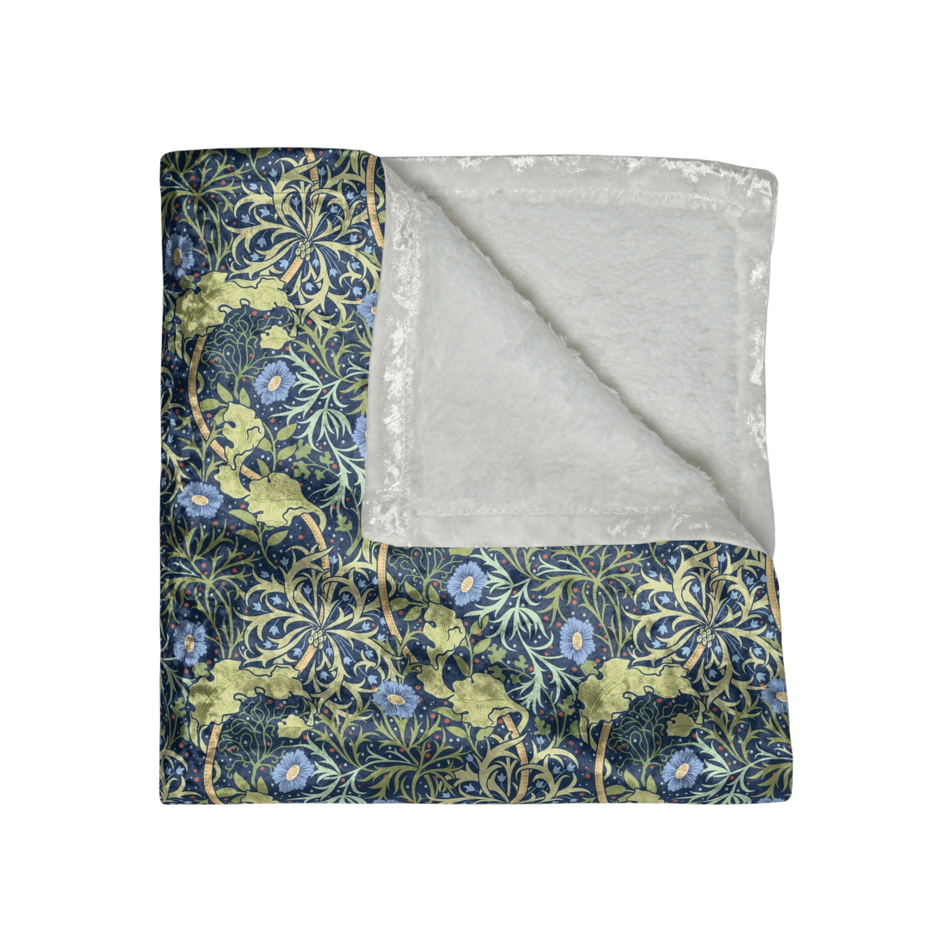 A plush blue floral patterned velvet blanket with hemmed edges and a silky finish.