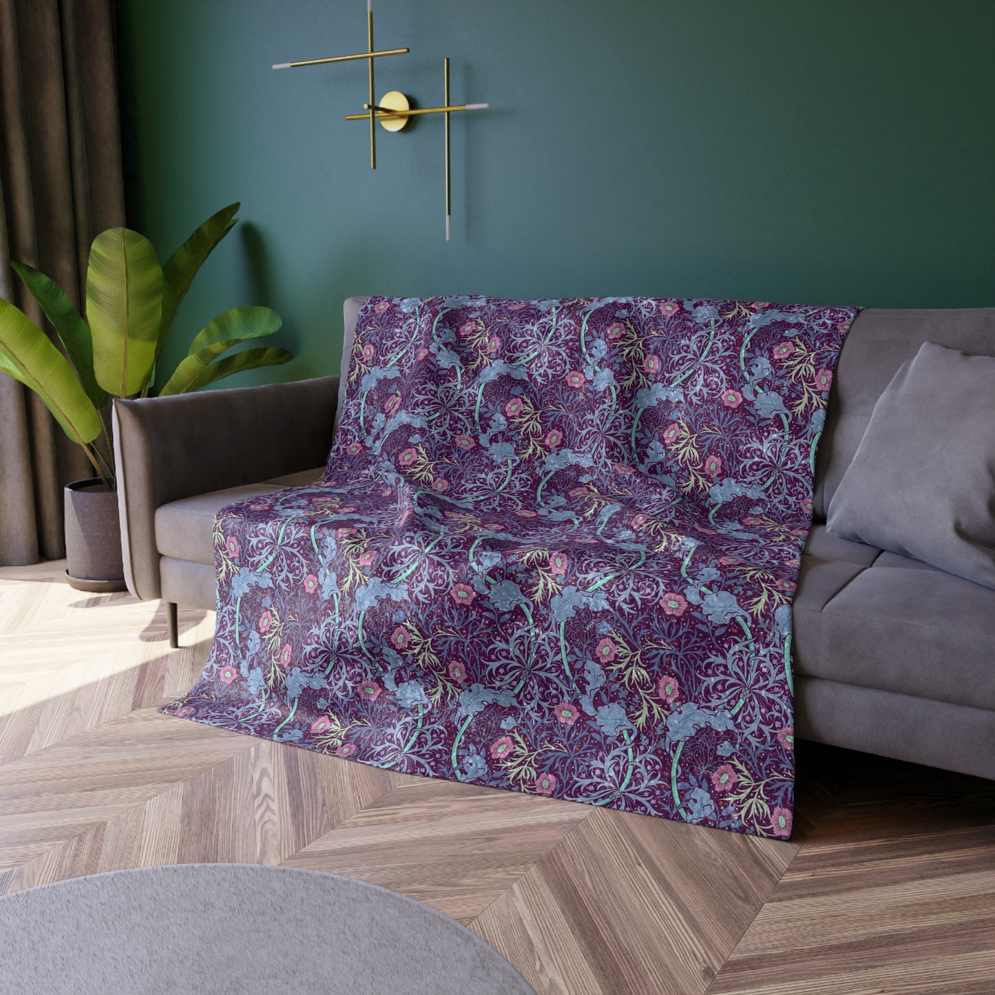 A plush velvet blanket with a floral William Morris & Co pattern in pink and purple hues, featuring hemmed edges and a silky finish.