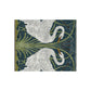 A lush crushed velvet blanket with a pattern inspired by William Morris, featuring a white swan design on a blue background, folded open to show the silky finish.