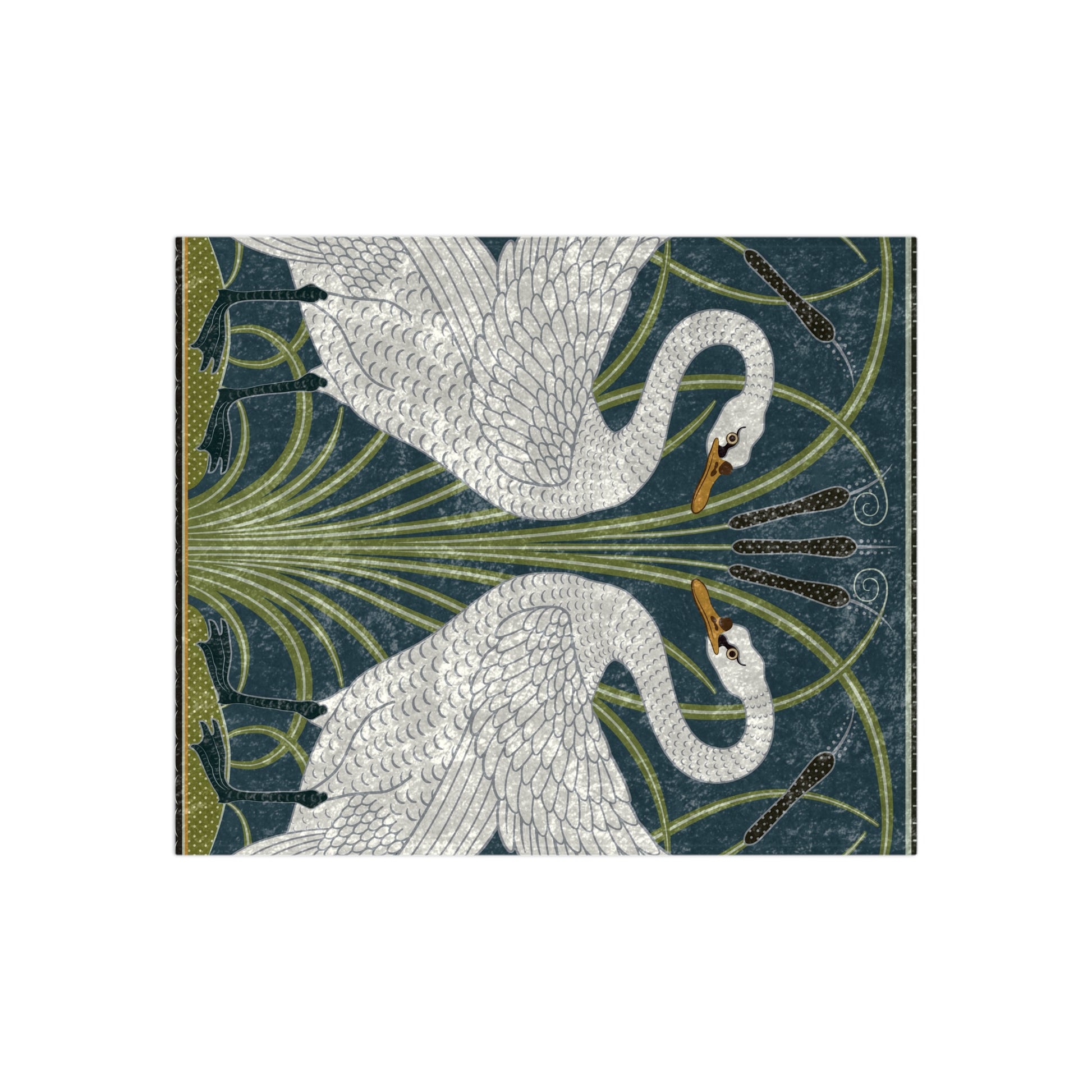 A lush crushed velvet blanket with a pattern inspired by William Morris, featuring a white swan design on a blue background, folded open to show the silky finish.
