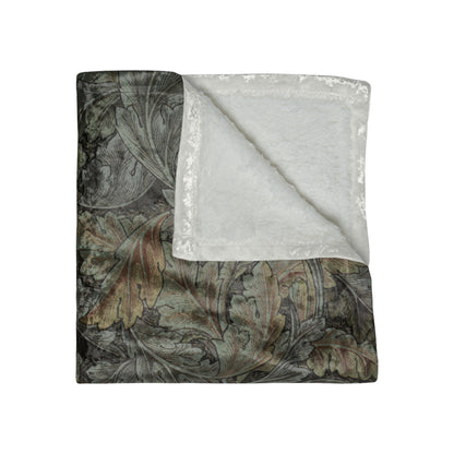 A plush, gray crushed velvet blanket with a floral pattern, folded to show both the right and wrong sides, with the soft, silky texture visible.