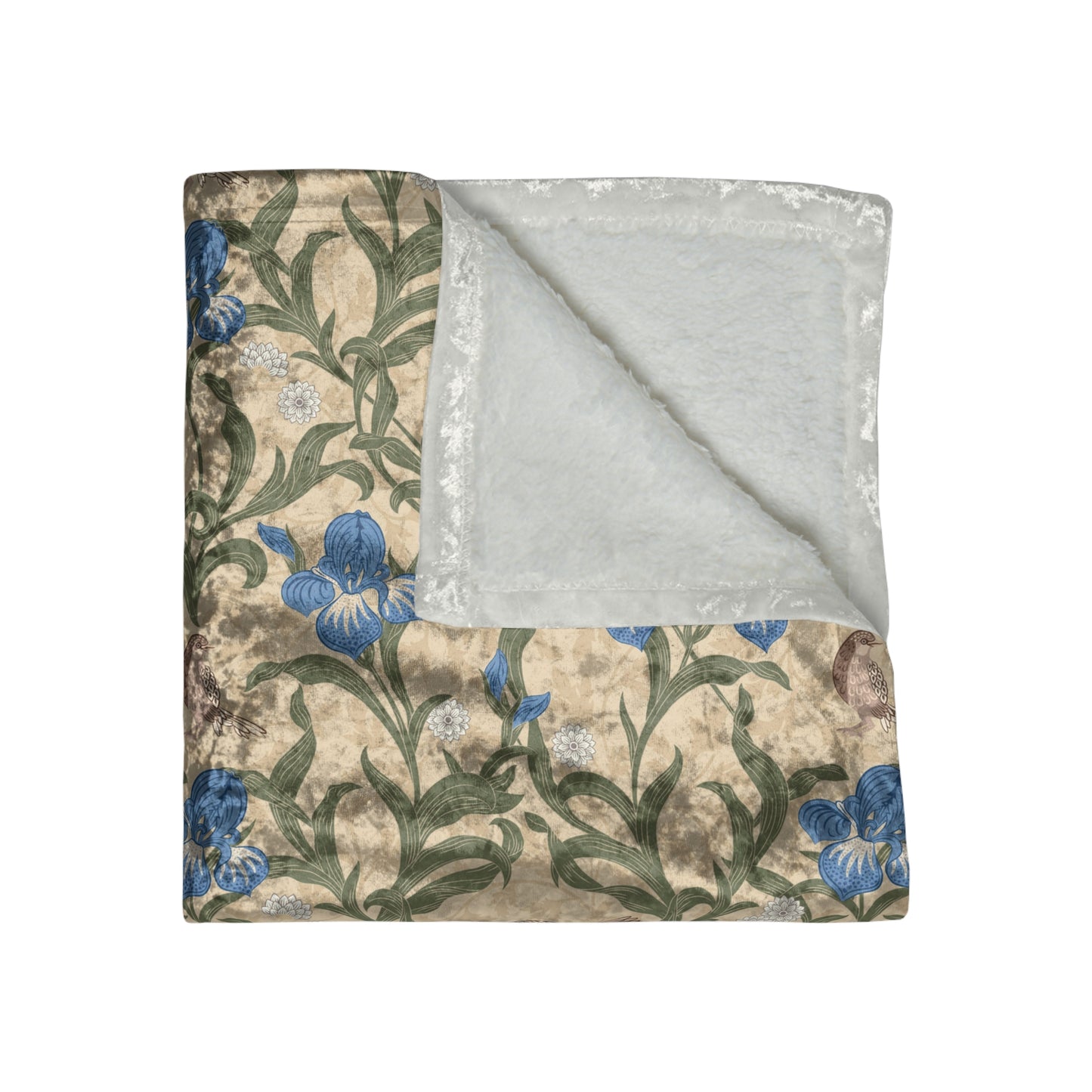 A plush velvet blanket with a floral William Morris & Co pattern in blue and yellow colours on a beige background, displayed on a flat surface.
