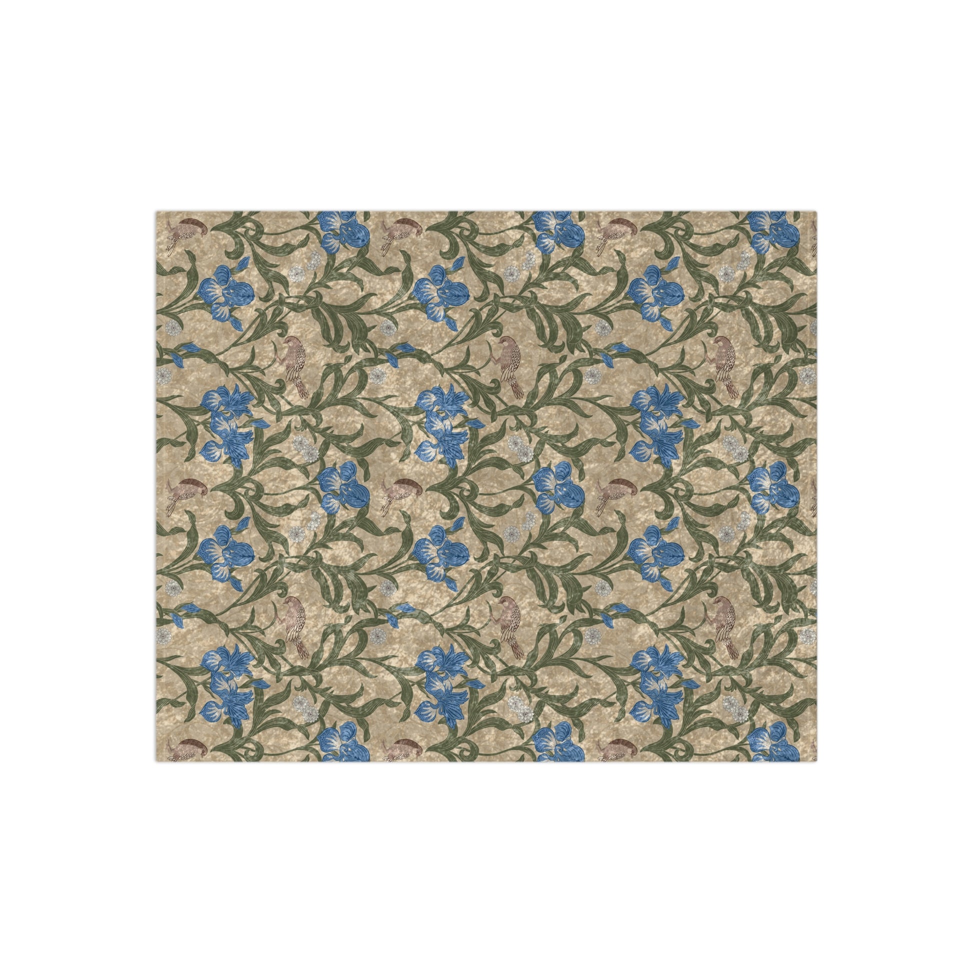 A plush velvet blanket with a floral William Morris & Co pattern in blue and yellow colours on a beige background, displayed on a flat surface.