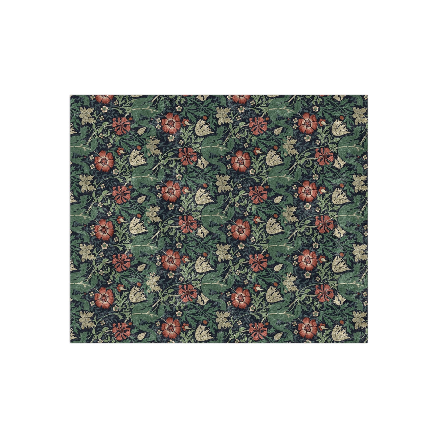 A lush crushed velvet blanket with a William Morris & Co floral pattern in green, red, and brown colours, displayed on a white background.
